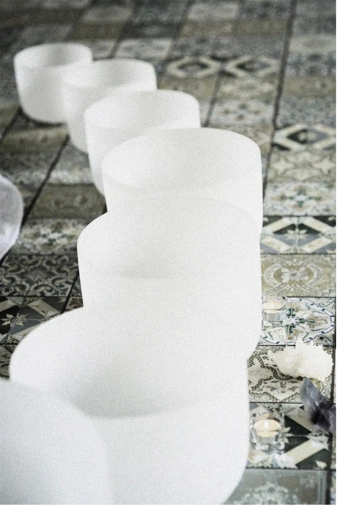 A row of crystal singing bowls