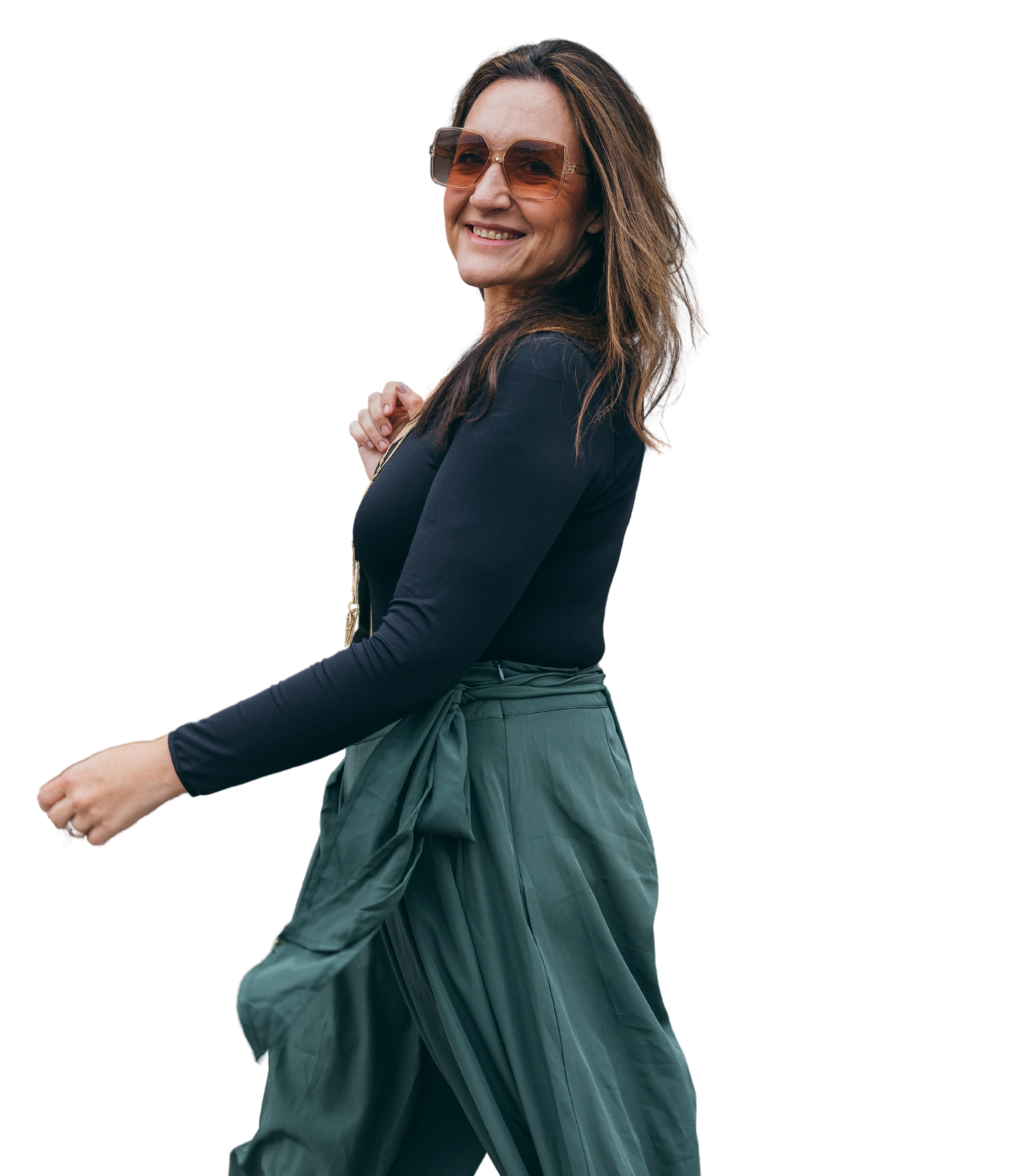 Kendra Beavis walking, smiling in sunglasses
